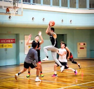 guy going in for a basketball shot